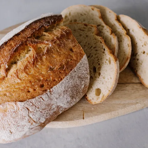 A sliced loaf of bread on a plate