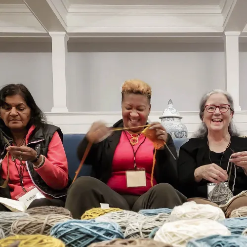 Three friends knitting